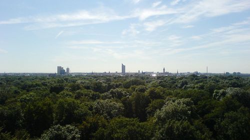 View of trees and buildings in city