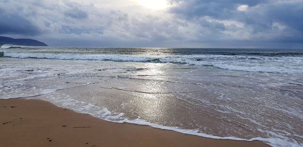 Scenic view of beach against sky