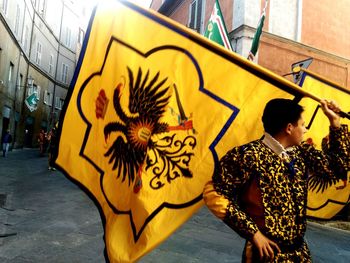 Man holding flag on street