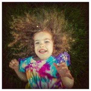 Portrait of smiling girl playing in grass