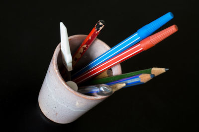 Close-up of desk organizer against black background