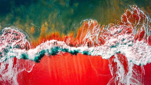 Aerial view of sea waves at shore