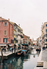 View of boats moored at canal