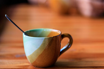 Close-up of coffee cup on table