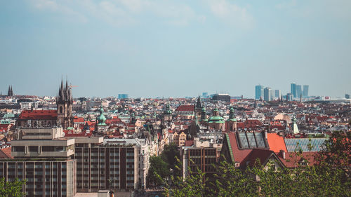 High angle view of buildings in city against sky