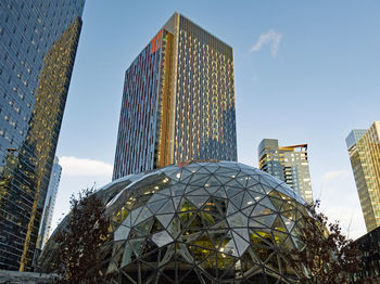 Low angle view of modern buildings against sky