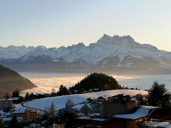 Scenic view of snowcapped mountains against sky during winter