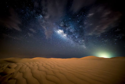 Scenic view of sea against sky at night