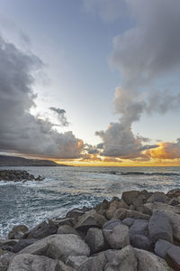 Scenic view of sea against sky during sunset