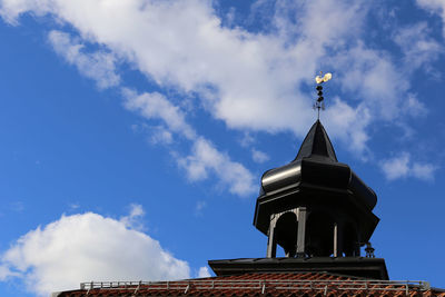 High section of building against blue sky