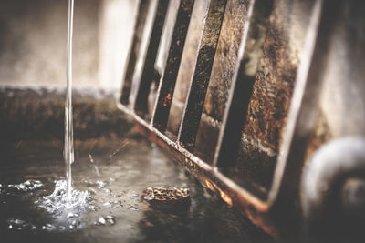 Close-up of water drops on rusty metal