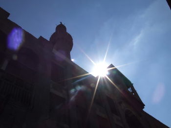 Low angle view of sunlight streaming through a building