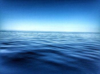 Scenic view of calm sea against clear sky