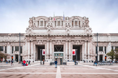 Group of people in front of historical building