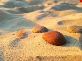 Close-up of pebbles on sand