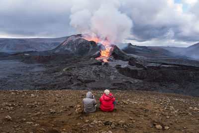 Rear view of people on mountain