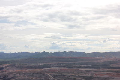 View of landscape against cloudy sky