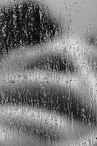 Close-up of water drops on glass