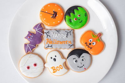 High angle view of candies in plate on table