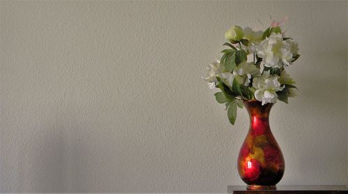 Close-up of flower vase on table