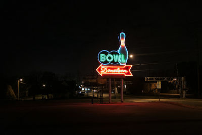 Illuminated light painting on road at night