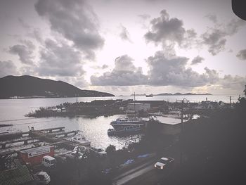 High angle view of harbor by sea against sky