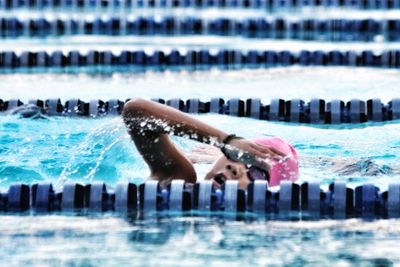 Young woman swimming in pool