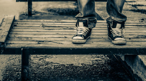 Low section of man standing on floor