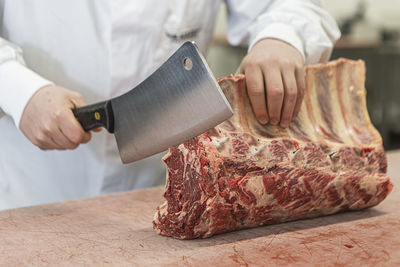 Midsection of person preparing food