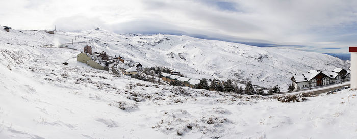 Scenic view of snowcapped mountains against sky