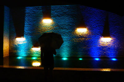 Blurred motion of woman at night