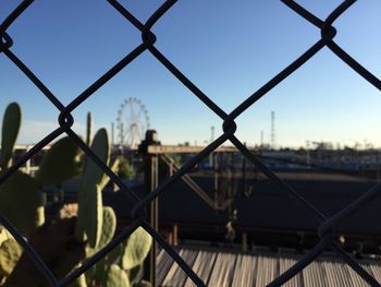 Close-up of chainlink fence against clear sky