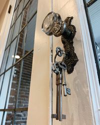 Low angle view of door knocker on building