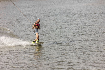 Full length of man standing in sea