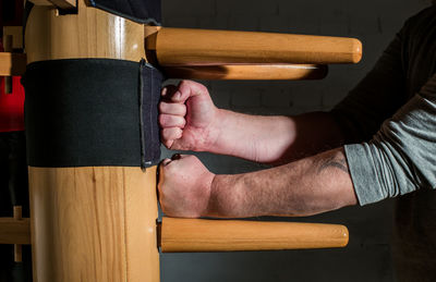 Close-up of man practicing martial arts on wing tsun