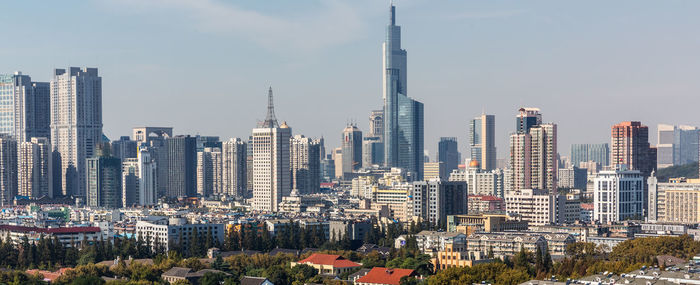 Modern buildings in city against sky