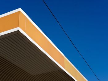 Low angle view of building against blue sky 