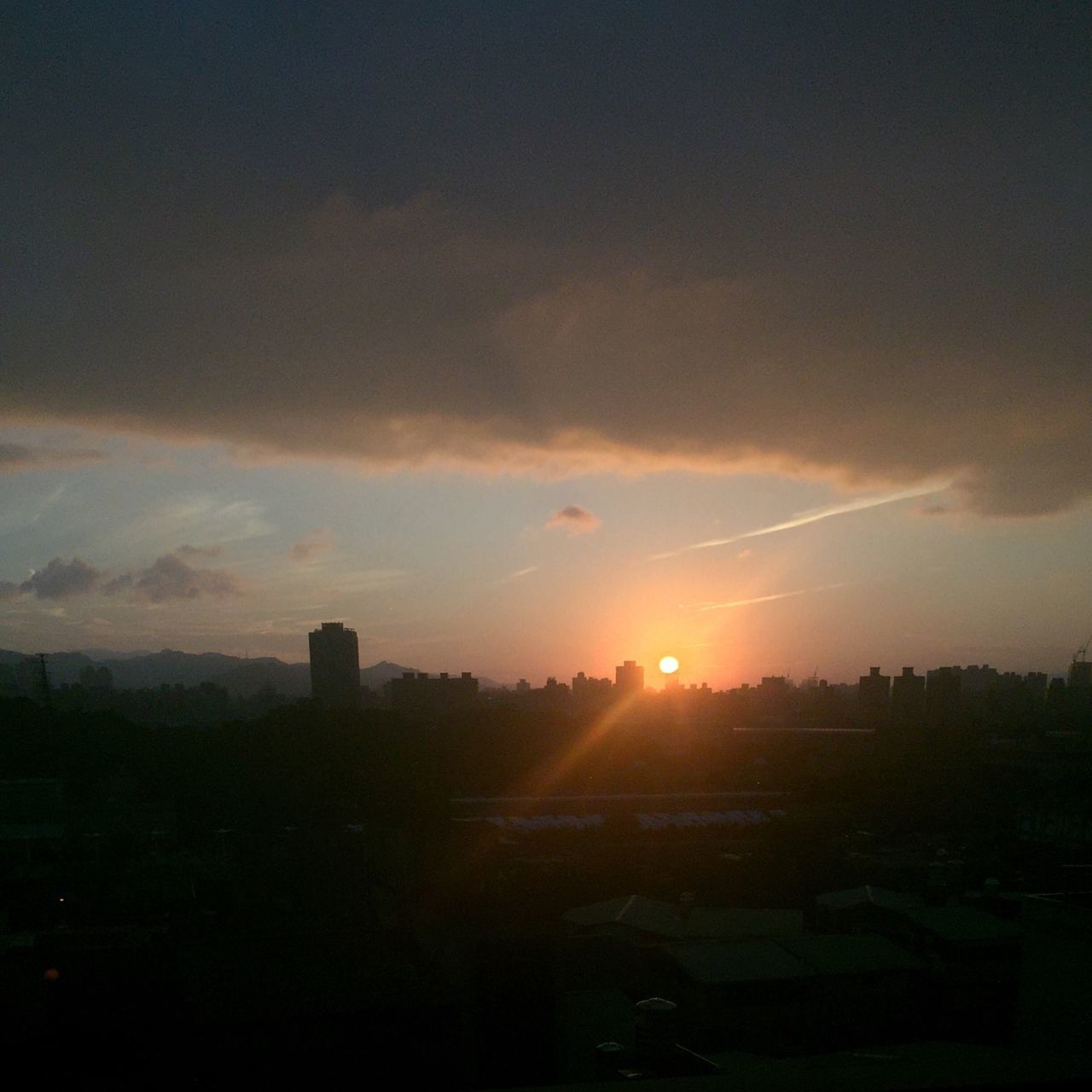 SCENIC VIEW OF SUNSET SKY OVER CITYSCAPE