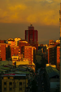 Cityscape against sky during sunset