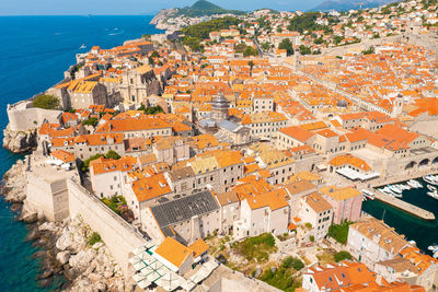 High angle view of townscape by sea