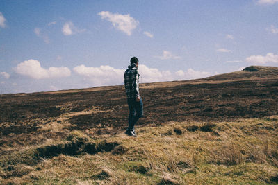 Full length of woman standing on field