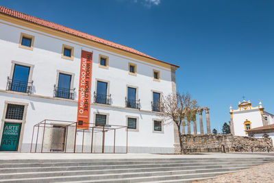 Low angle view of building against clear blue sky