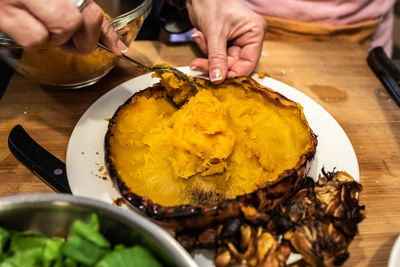 High angle view of person preparing food on table