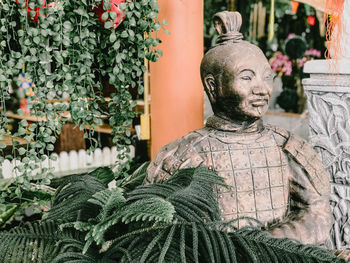 Statue of buddha against temple