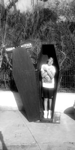 Portrait of woman with text on tree