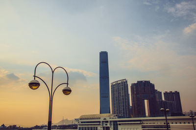Low angle view of buildings against sky during sunset