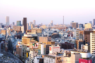 High angle view of buildings in city against sky