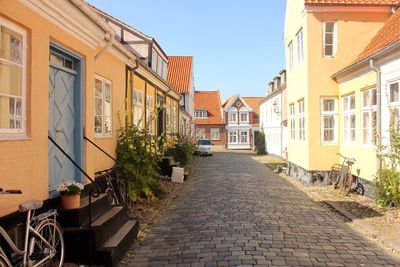 Street amidst buildings against sky