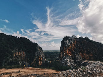 Panoramic view of rocks on land against sky