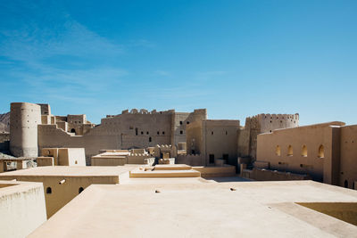 Historic buildings against blue sky